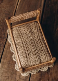 Image 12 of A wooden bed wrapped with thick rope