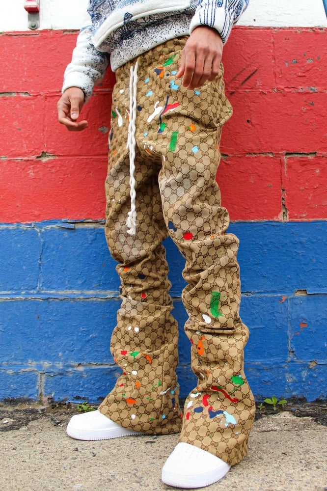 Image of SPLATTERED GG MONOGRAM FLARE PANT + DRACO
