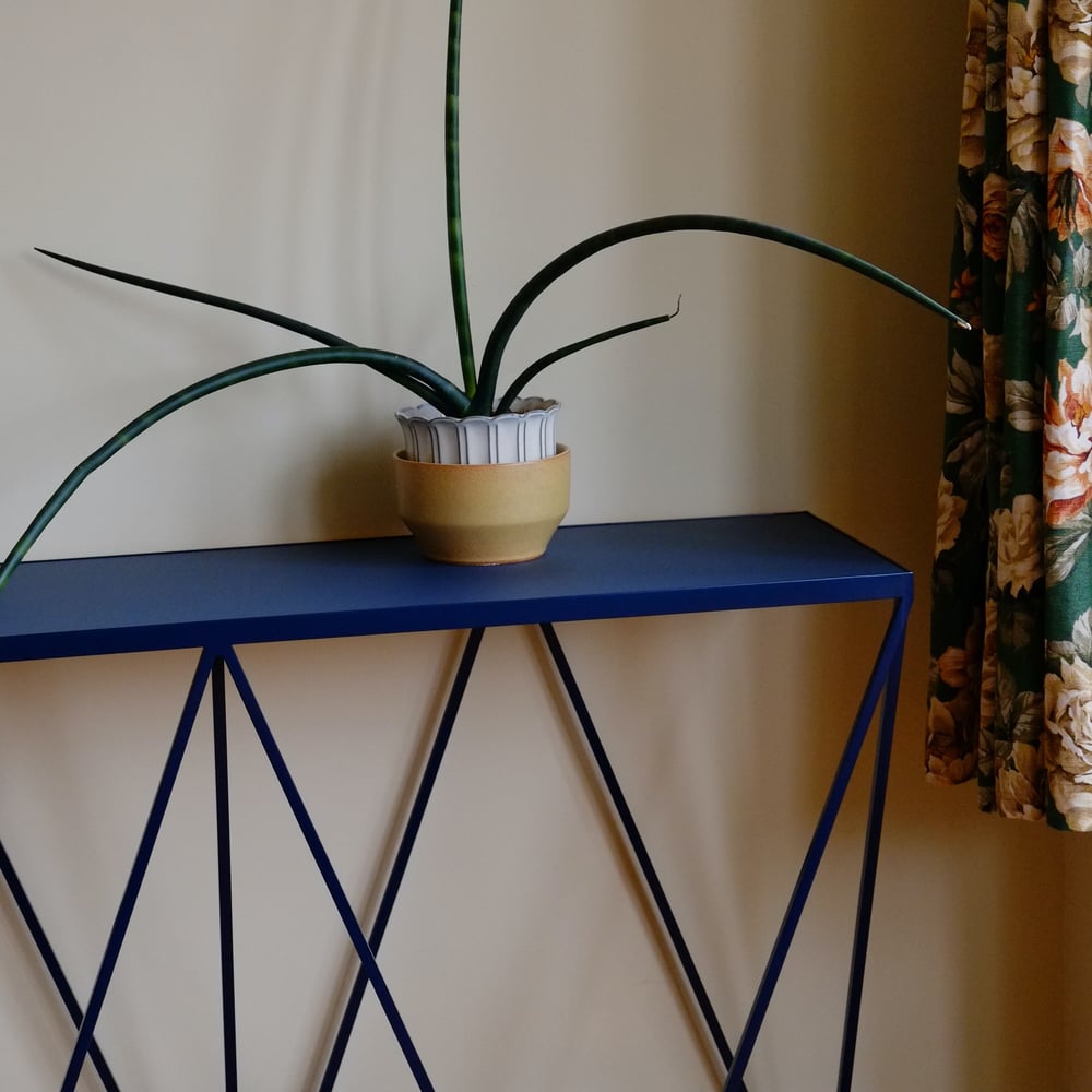 Image of Giraffe console table with natural linoleum top