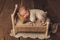 Image 7 of A wooden bed wrapped with thick rope