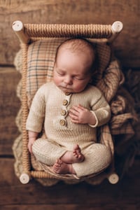 Image 9 of A wooden bed wrapped with thick rope