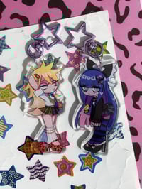 Image of panty & stocking 3in acrylic charm + big stickers