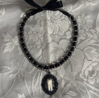 sweet tooth necklace