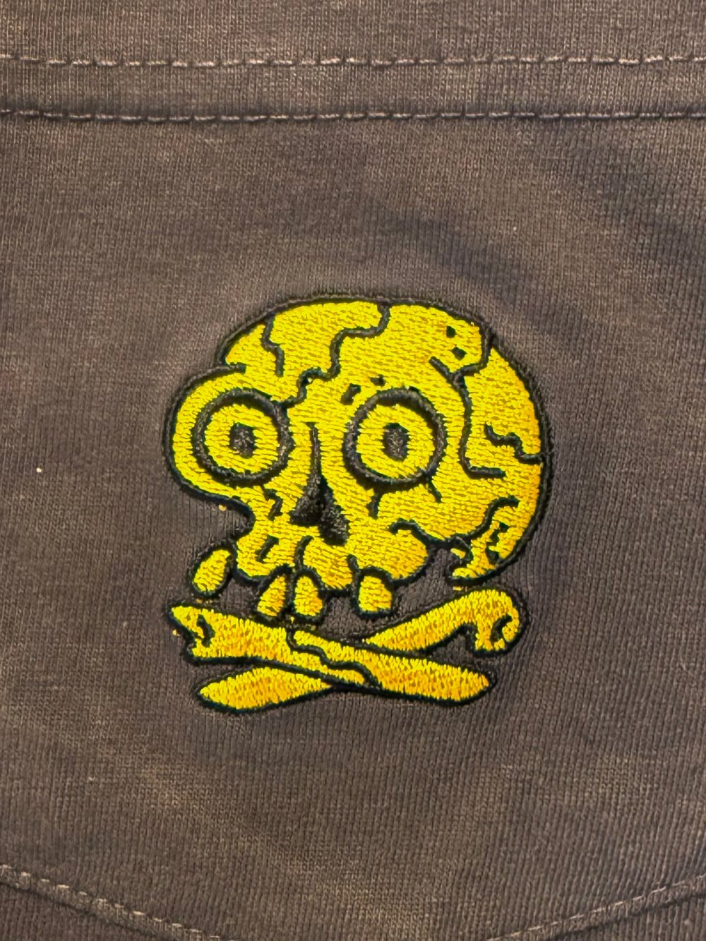 White pocket t with skull 
