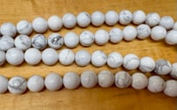 Image 2 of White Howlite 6mm round 8 inch strand Approx. 31 beads