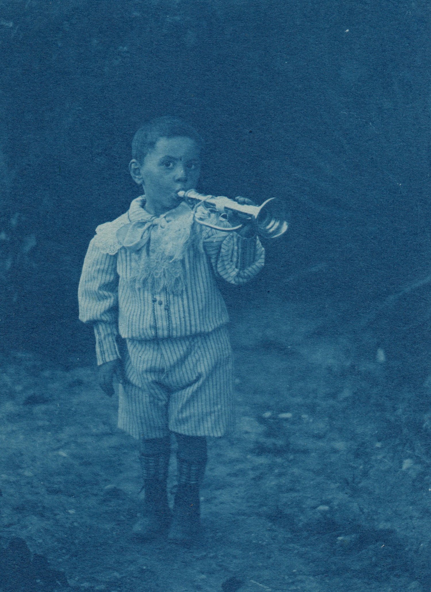 Image of Unknown: boy with a trumpet, France ca. 1900