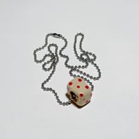 bead on necklace three
