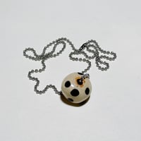 bead on necklace four
