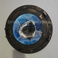 Image 1 of LED Shark Attack Porthole Wall Light – Cracked Glass Illusion Nautical Horror Decor