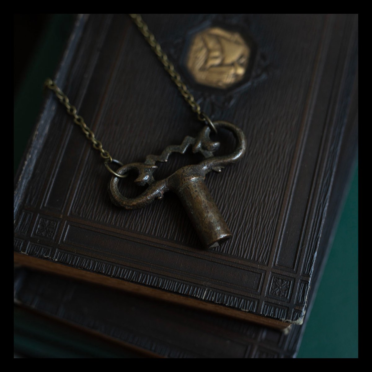 Ornate brass gas valve key necklace