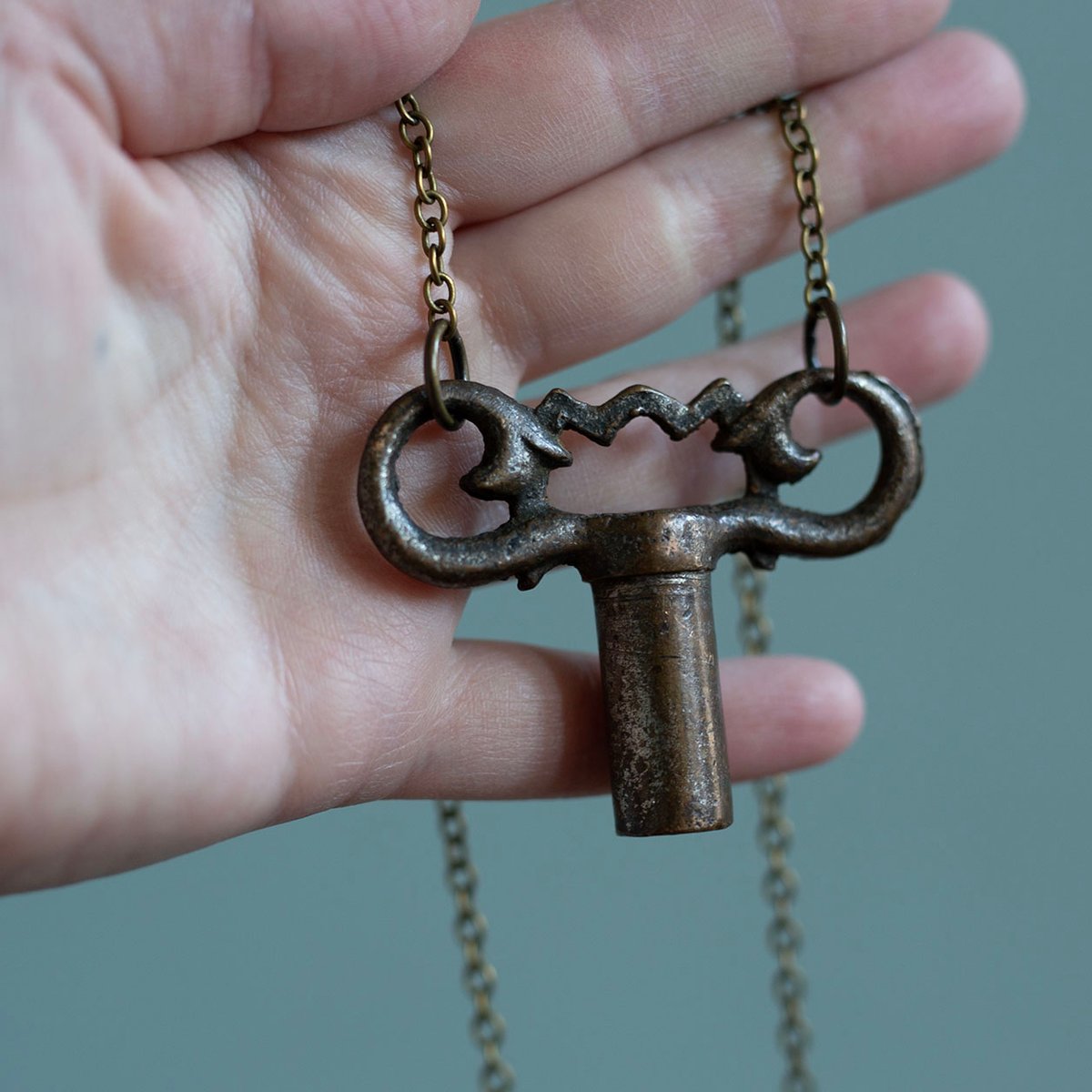 Ornate brass gas valve key necklace