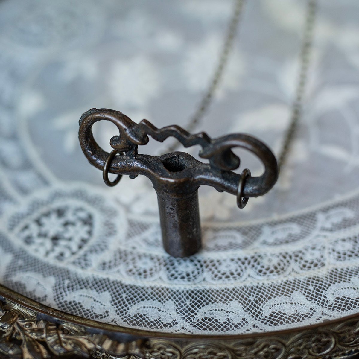 Ornate brass gas valve key necklace