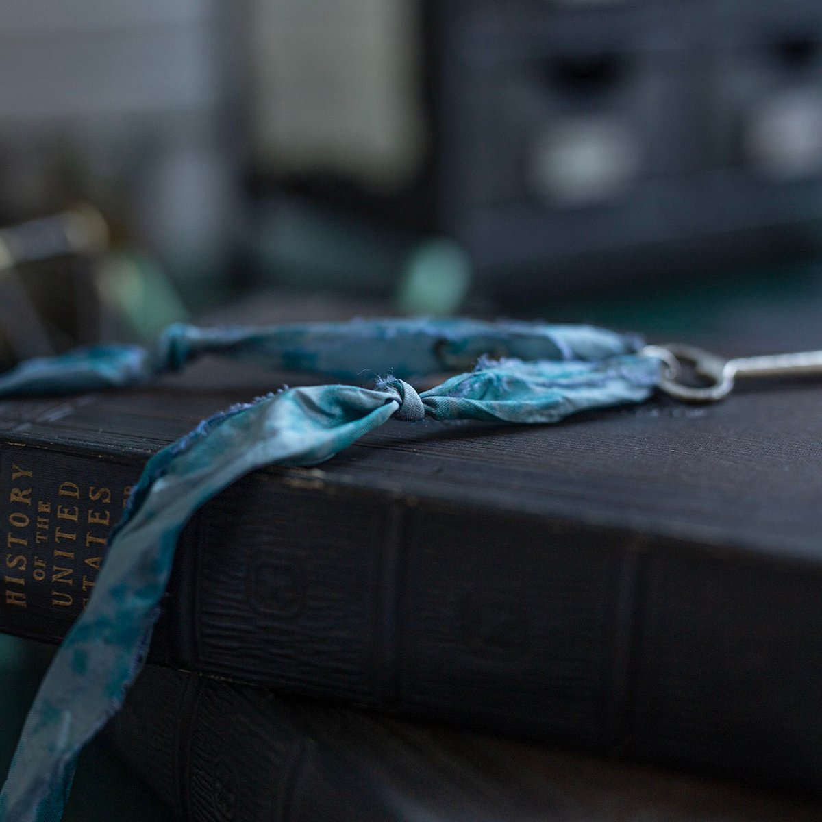 Large silver key on "dusty cloud" cord