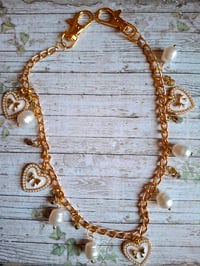 Image 1 of Golden Bow Heart Charm