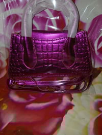 Image 3 of Womens pink pocketbook comes with strap and Button to close pocketbook One left 