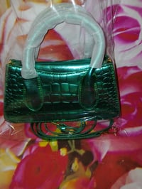 Image 3 of Womens green pocketbook, comes with strap and button to close pocketbook one left.