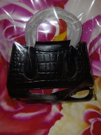 Image 3 of Womens black  pocketbook comes with strap and Button to close pocketbook 1 left 