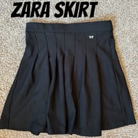 zara. cheerleader skirt with metal bow
