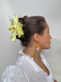 Image 3 of yellow hibiscus claw