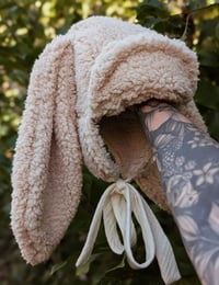 Image 1 of Fleece trapper with oversized bunny ears 