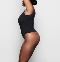 Image 4 of SKIMS- ESSENTIAL SLEEVELESS CREWNECK BODYSUIT THONG- SOOT