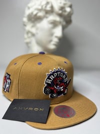 Image 1 of Toronto Raptors Snapback Hat (Yellow)