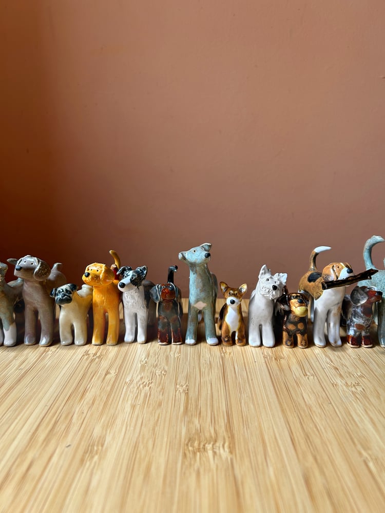 Image of ceramic pooch sculptures
