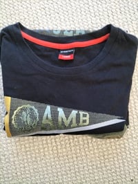 Image 4 of The Cheetah Men's Black Large T-Shirt is a vintage 90s-inspired piece featuring a bold cheetah print