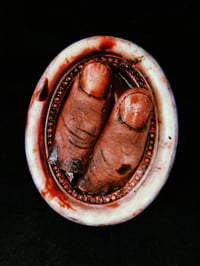 Image 4 of Severed Thumbs in White Oval Frame 