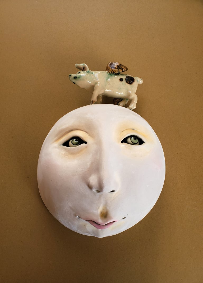  Wall mask with winged pig