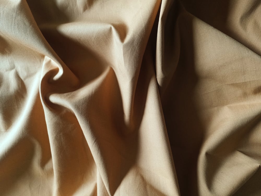 Image of Namaste fabric uni camel