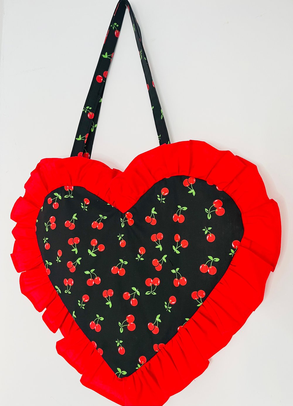 Image of Heart-Shaped Black & Red Cherry Bag with Red Ruffle Trim
