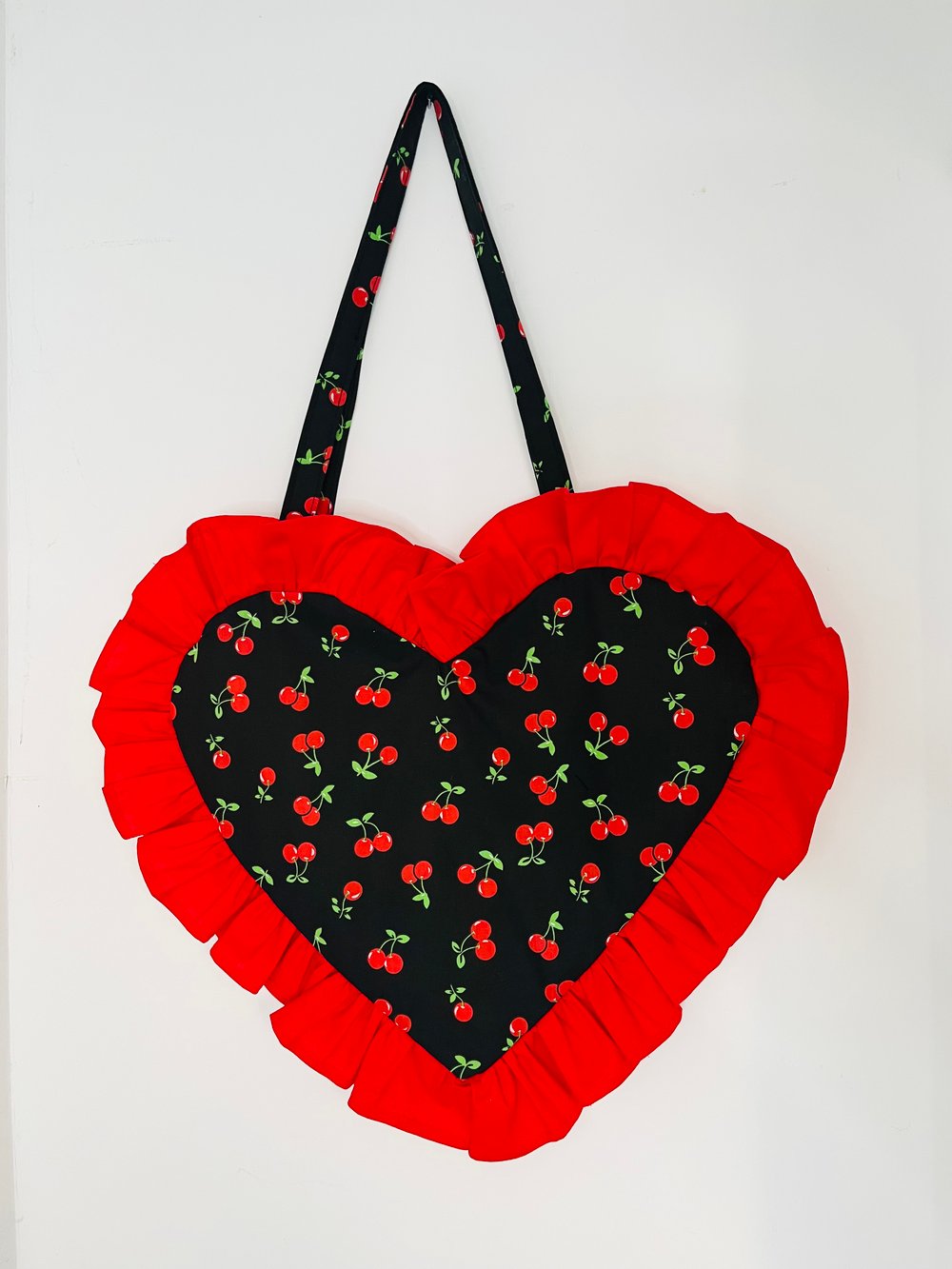 Image of Heart-Shaped Black & Red Cherry Bag with Red Ruffle Trim