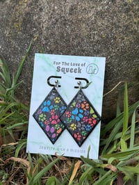 Image of *Pawprints on Wooden Triangles*