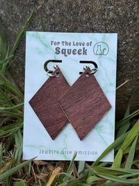 Image of *Pawprints on Wooden Triangles*