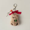 red bowed bear charm