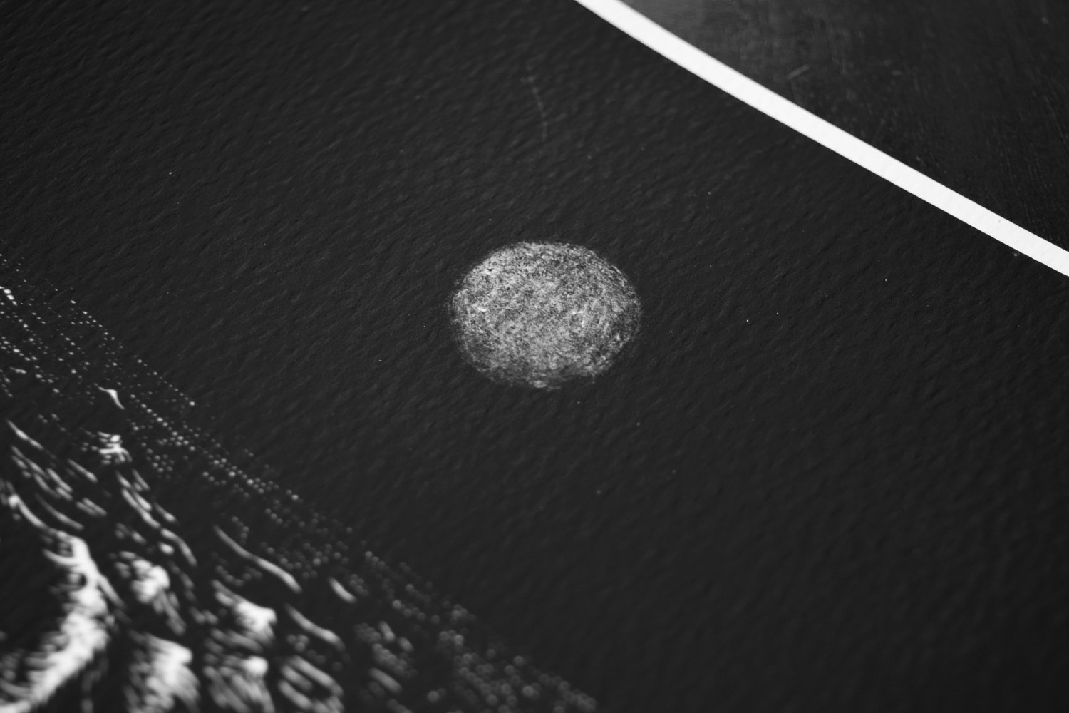 Image of heavenly body o'er a primordial sea