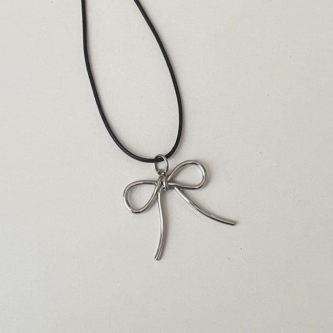 big silver bow black cord necklace