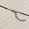 big silver bow black cord necklace