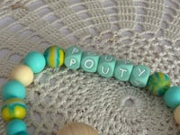 Image 2 of “Pouty” Pacifier Clip
