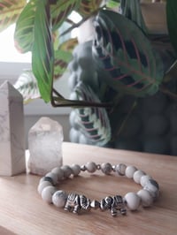 Image 1 of Howlite elephants