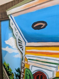 Image 3 of Yellow House behind fence