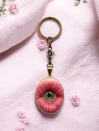 Image 2 of Mouth with eye pendant keychain I