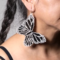 Image 1 of White and black beaded handmade butterfly earrings 