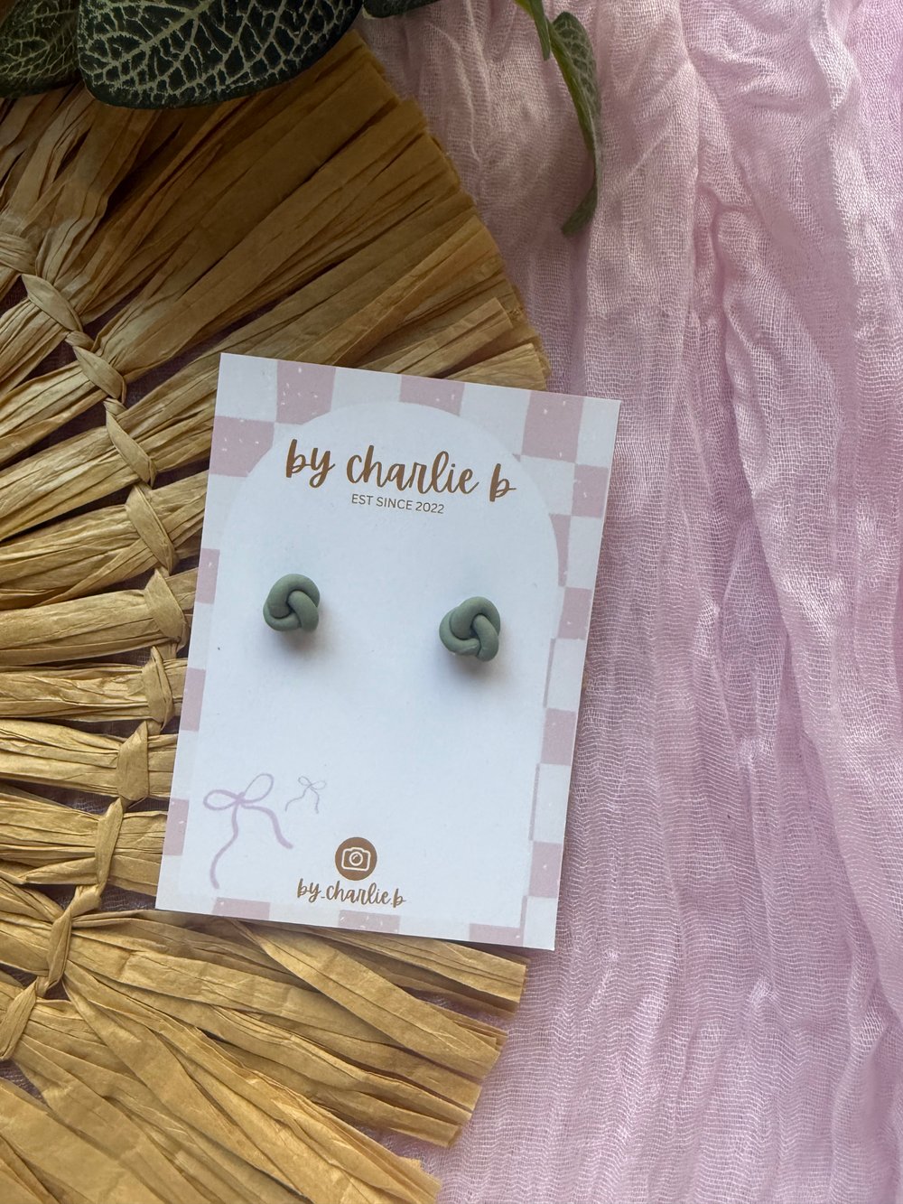 Image of dark green knot studs 
