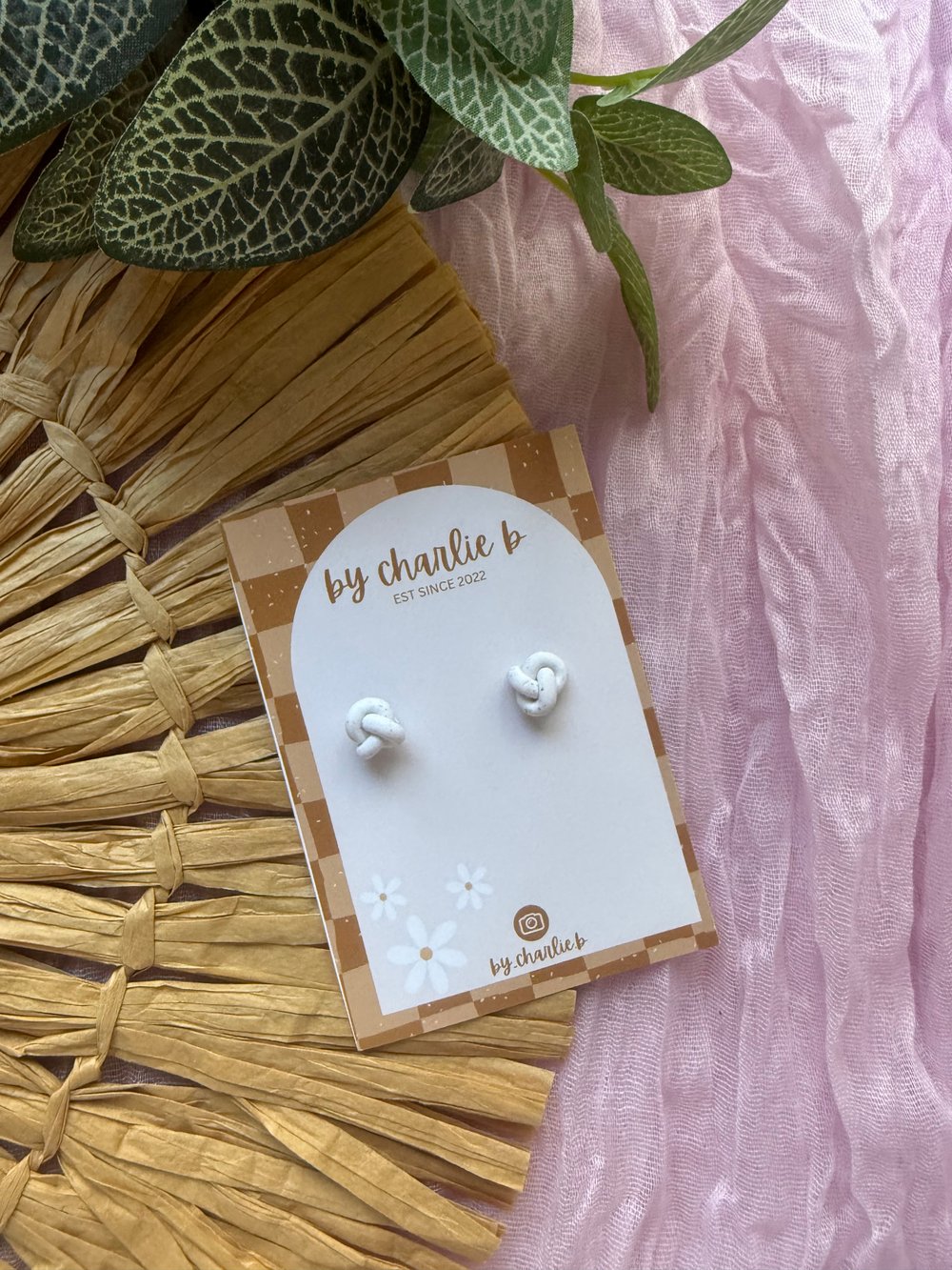 Image of white knot stud 