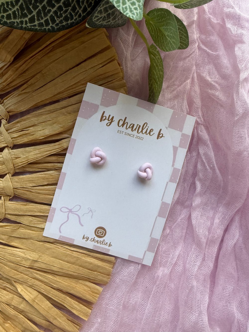 Image of baby pink knot stud 