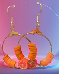 Image 1 of Radiant Orange Polymer Clay Bead Earrings with Central Charm Accent