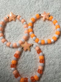 164 Orange Star Stretch Bracelet