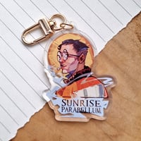 Image 2 of Disco Elysium | Kim Sunrise Parabellum Keychain [two-sided]